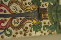 Shading and more drawing details can be observed on the elements made with gold and silver painting